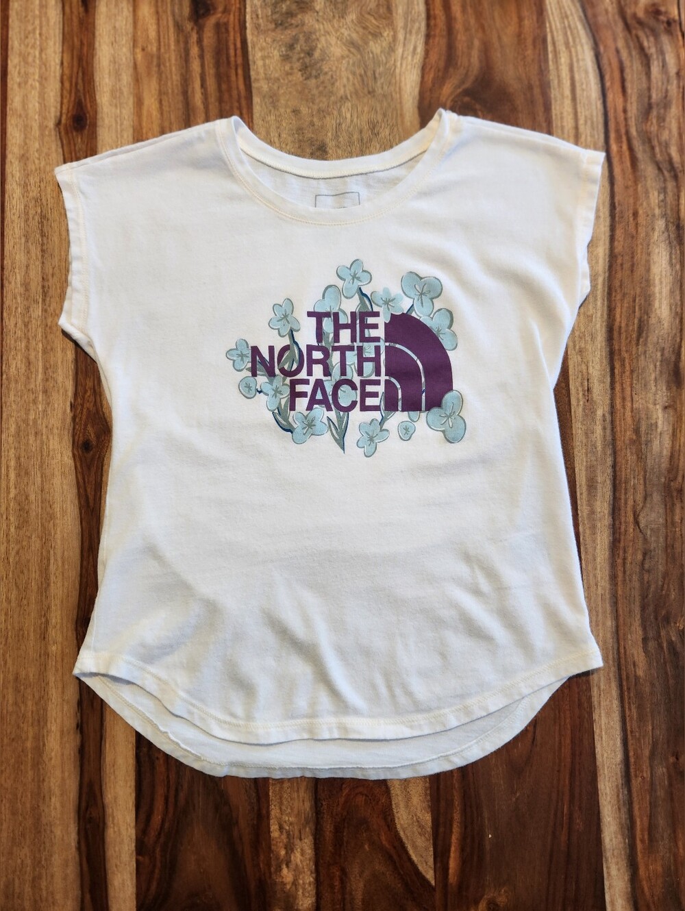 The North Face Girls Off White Sleeveless Tee with Purple and Blue Design